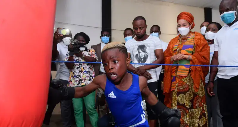 The United Nations Deputy Secretary-General Amina J. Mohammed watches children training at a boxing gym in an informal settlement in the Ghanaian capital Accra