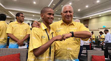 The Prime Minister of Fiji, Josaia Voreqe Bainimarama with youth climate activitist Timothi Nausulasala at the opening of the first Fijian National Youth Climate Action Summit.